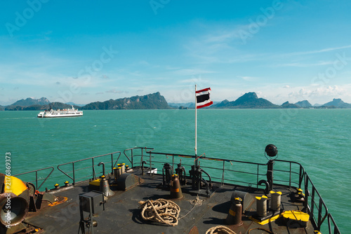 Konstfotografi Thai Flag Flying from Ferry Bow Above Turquoise Sea and Island