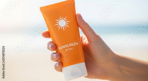 A hand holding a tube of sunscreen by the beach illustration