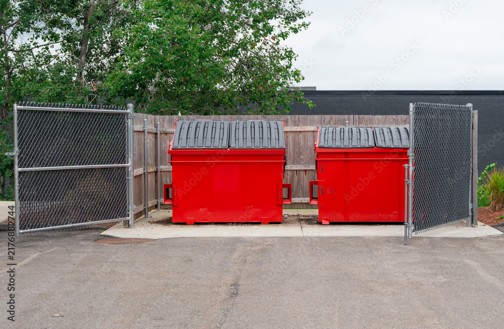 Obraz premium large red commercial dumpster for trash and recycling