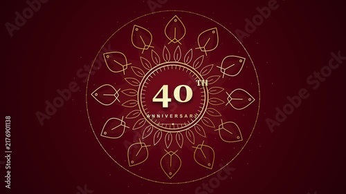 elegant 40th anniversary celebration video featuring a rotating golden mandala design with intricate leaf patterns against a rich dark red background.
