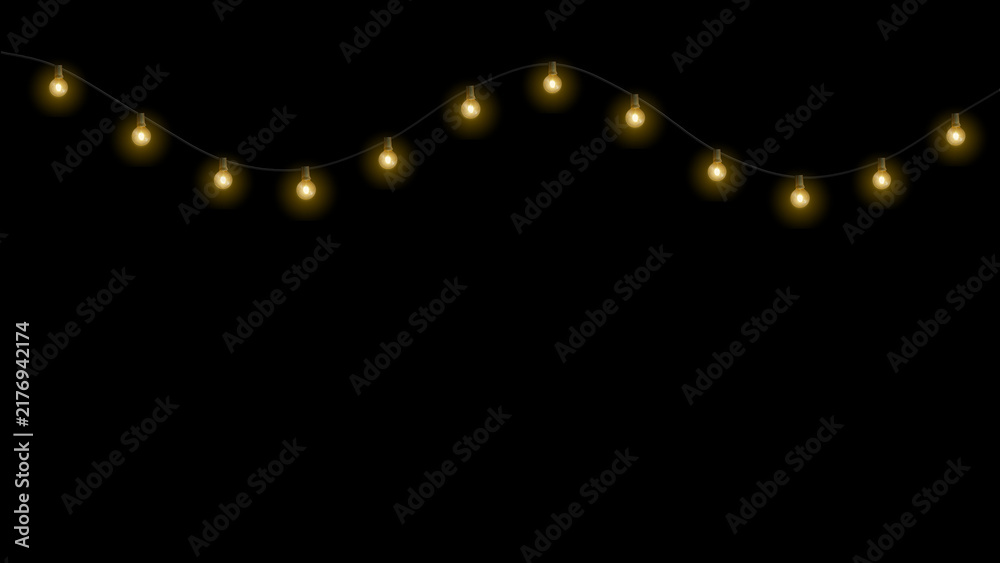 Obraz premium Glowing Christmas string lights garland isolated on black background