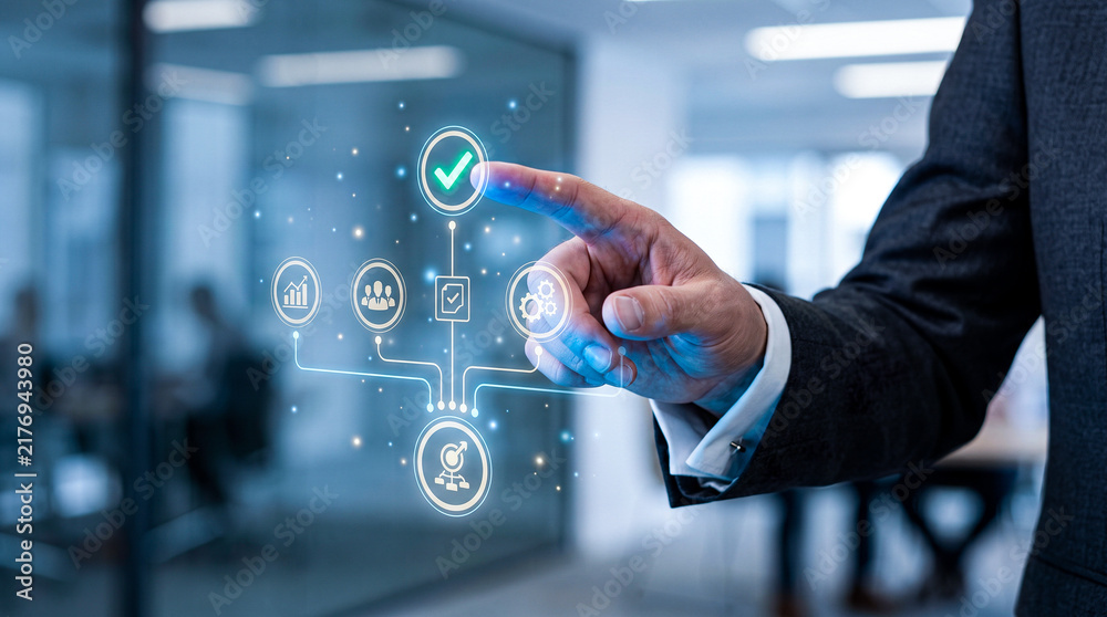 Obraz premium Businessman interacting with digital business process management icons and workflow automation interface in modern office