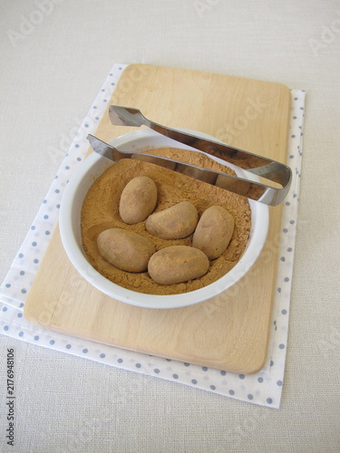 Homemade marzipan potatoes or marzipan eggs with low-histamine carob powder as a substitute for cocoa
