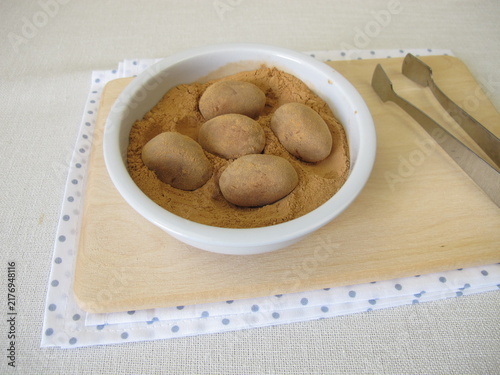 Homemade marzipan potatoes or marzipan eggs with low-histamine carob powder as a substitute for cocoa