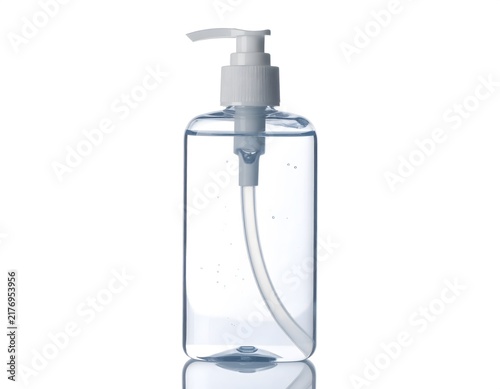 Transparent plastic bottle filled with clear liquid and white pump dispenser isolated on white background