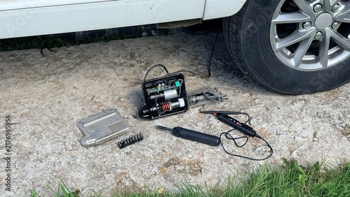 Cuadro en lienzo Dismounted caravan ATC trailer control system unit on gravel near vehicle tire d
