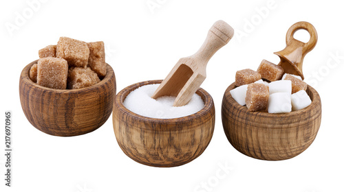 Принти на полотні Brown and white sugar cubes and granulated sugar in small wooden bowls with scoo