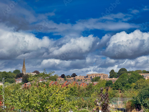 Obraz na płótnie Exeter City Skyline View with Church Spire and Dramatic Blue Sky