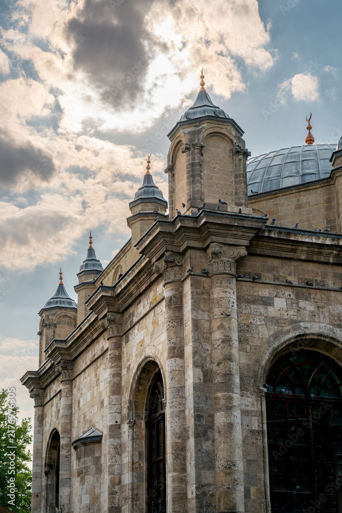 Naklejka premium Aziziye Mosque facade and domes under dramatic Konya sky