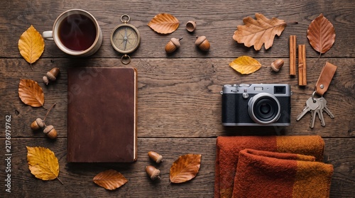 Autumn Travel Flat Lay with Leather Notebook Camera and Copy Space on Wooden Background