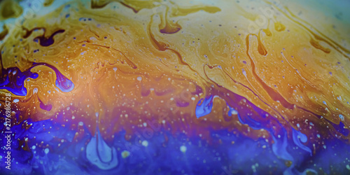Iridescent soap film creating fluid colorful abstract patterns