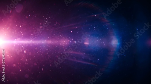 Abstract background with glowing pink light flare and floating particles