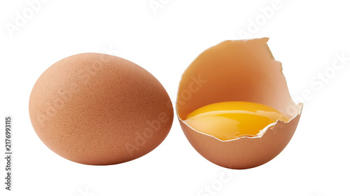 Konstfotografi Whole brown chicken egg and broken eggshell with raw yolk
