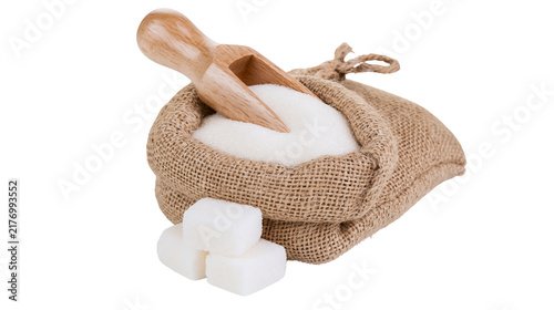 фотографія Granulated white sugar in a small burlap sack with a wooden scoop and sugar cube