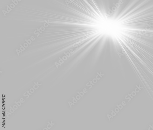 An intense white light source emits dynamic rays across a black background. The beams are sharp and directional, radiating predominantly from the upper right.