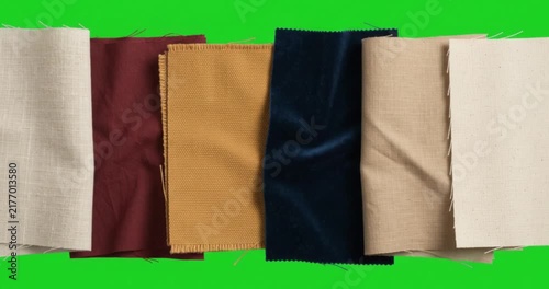 3D colorful fabric swatches and textile samples on green screen background