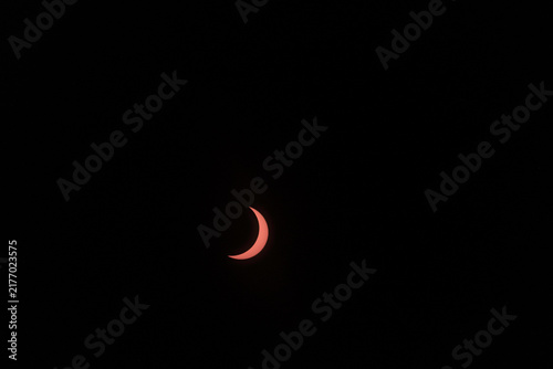 Fotografie View of the partial solar eclipse, during partiality, in the countryside around