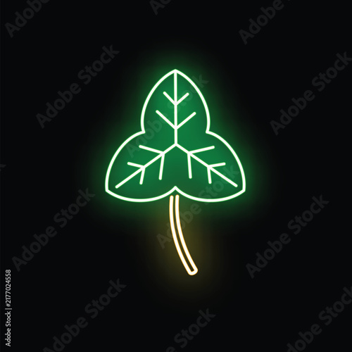 Green neon shamrock leaf glowing with light on black background