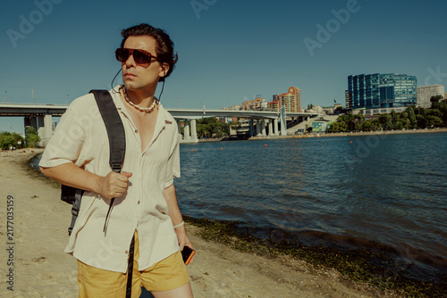 Canvas Print Stylish man in linen shirt posing on the left bank of the Don River in Rostov-on-Don