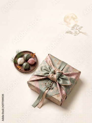 Elegant Korean Chuseok design card featuring a beautifully folded traditional bojagi wrapping, small songpyeon.
