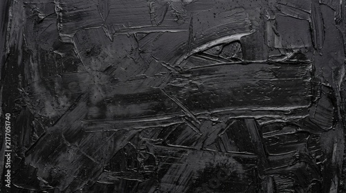 Abstract monochrome painting featuring thick black oil paint with heavy textured brushstrokes and palette knife marks.