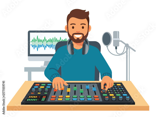 Man with beard using audio mixing console in home studio setup