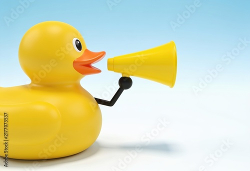 Bright yellow rubber duck holding a megaphone speaking into it against light background