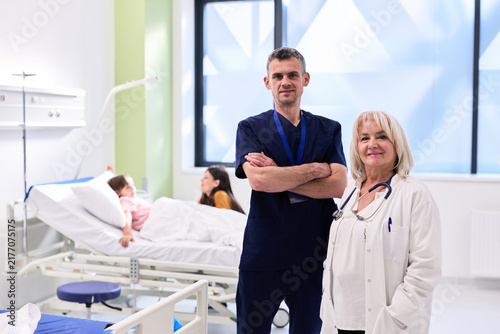 Healthcare professionals in a modern hospital setting providing care to patients