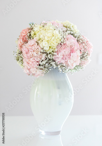 Pastel hydrangea bouquet with baby's breath in vase
