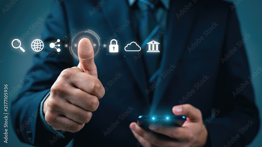 Obraz premium Businessman in a suit using biometric fingerprint authentication technology on a digital interface screen with scanner interface with suit interacts