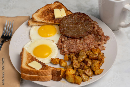 Quadro su tela fried eggs with  sausage patty  and corn beef hash