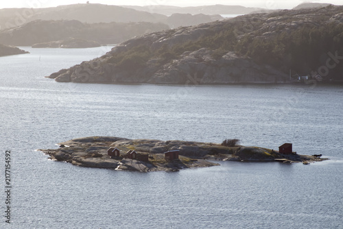 Isolated Small Island with Red Cabins in Fjällbacka Archipelago Sweden