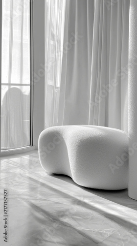 White textured organic bench in a sunlit minimalist room with sheer curtains and long shadows on a marble floor