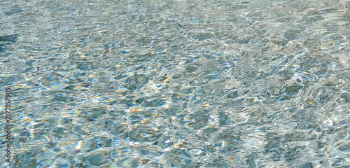 Принти на полотні Clear shimmering water ripples texture background with bright sunlight caustic r