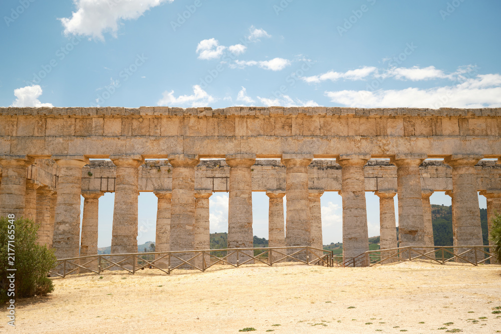 Fototapeta premium Horizontal side elevation view of Doric colonnade of ancient Greek temple in Segesta, Sicily, Italy