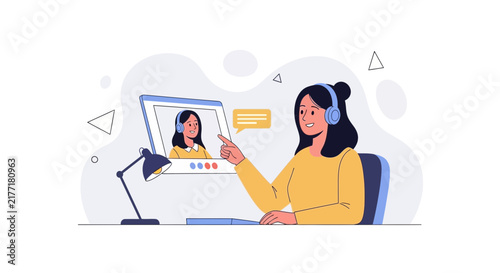 Young woman with headphones interacting with a video call on a computer screen, illustrating online communication and learning
