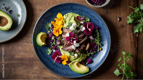 Beautifully plated fresh vegetable and avocado salad on a dark wooden table