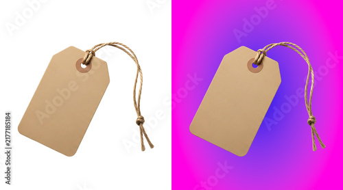 Fotografie A blank rectangular beige paper price tag with a brown string attached, isolated