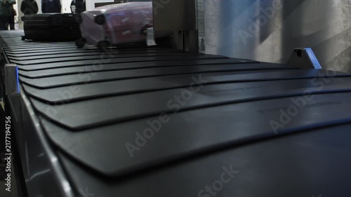 Suitcases getting dropped on the baggage carousel at an airport, 4k