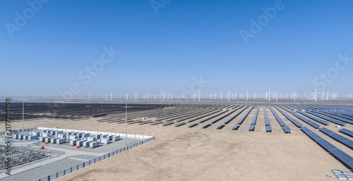 Aerial View of Integrated Renewable Energy Base with Solar, Wind, and Storage on Desert