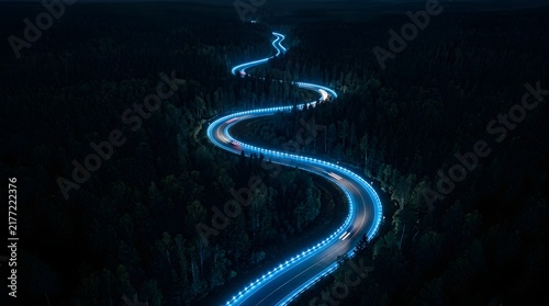 Photography Blue glowing abstract light trails captured in long exposure photography against