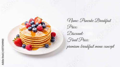 Stacked fluffy pancakes with fresh berries and syrup premium breakfast presentation with arranged elegantly white plate against clean background