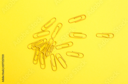 Yellow Paperclips on Yellow Background