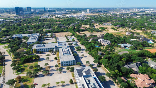 Bild auf Leinwand Rooftop solar arrays line commercial tech centers adjacent to Stonebriar Creek Estates