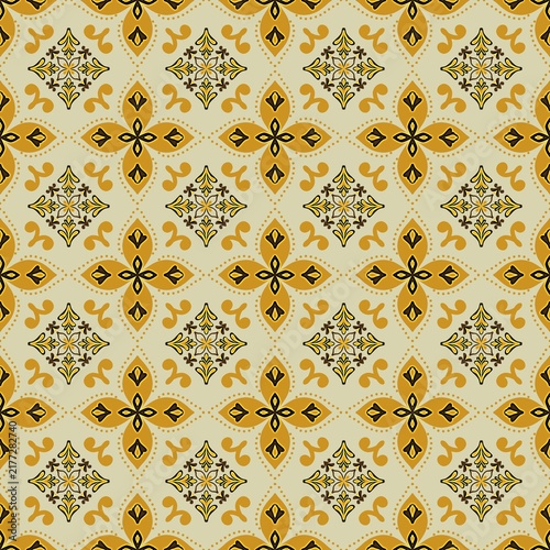 Seamless ethnic batik pattern featuring golden-yellow star cross motifs and delicate ornamental flowers on a warm beige background