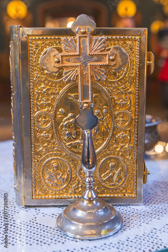 Fotografie Ornate Orthodox religious icon stand or altar cross with elaborate gold decorative patterns and traditional three-bar Orthodox cross symbol