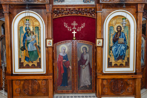 Photography Ornate wooden iconostasis with traditional Orthodox icons of Mary and Jesus