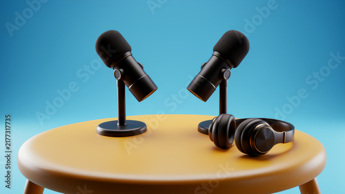 Two tabletop microphones and black headphones arranged on round golden platform against blue background representing interviews podcast dialogue collaborative recording and shared audio production