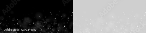 Fotografie A scatter of white glowing particles appears against a black background