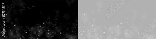 Soft glowing particles float gently across a dark background. The bright white dots vary in size and density, creating a dreamy bokeh effect. This delicate light overlay is perfect for.